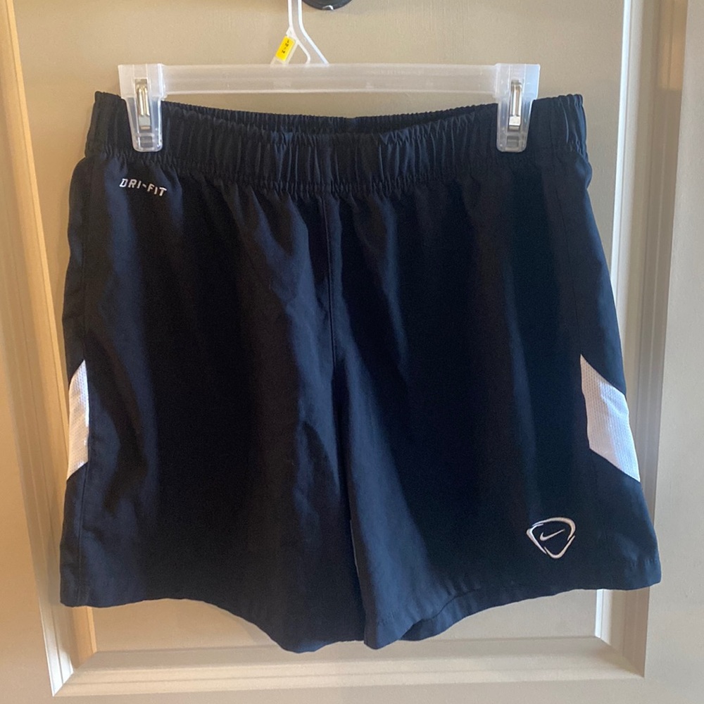 black Nike shorts.